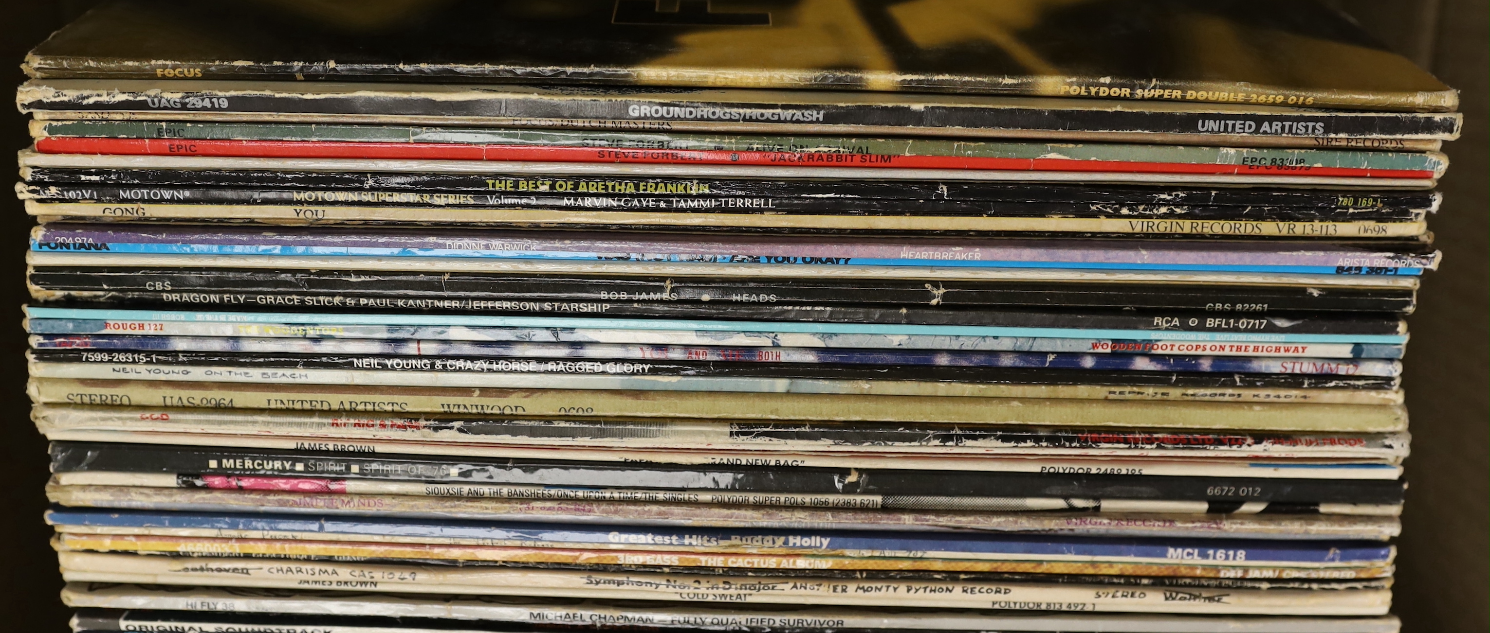 Seventy mostly 1970's/80's LPs, including Focus, Steve Forbert, Aretha Franklin, Dionne Warwick, Dire Straits, Simple Minds, Neil Young, Bruce Springsteen, etc.